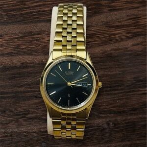 Citizen Gold Timepiece with Dark Dial